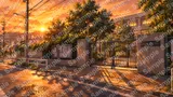 夕暮れ時の校門と影が伸びる下校路